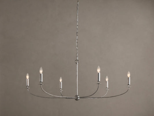 Arnett Round Chandelier. Antiqued silver finish iron frame, 6 candelabra bulbs on curved arms, hanging from chain.