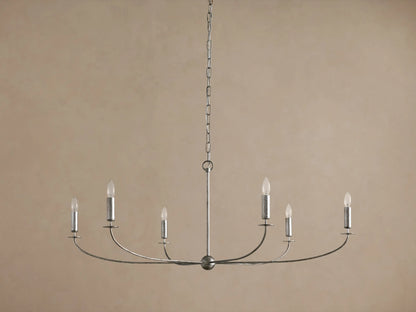 Arnett Round Chandelier. Antiqued silver finish iron frame, 6 candelabra bulbs on curved arms, hanging from chain.