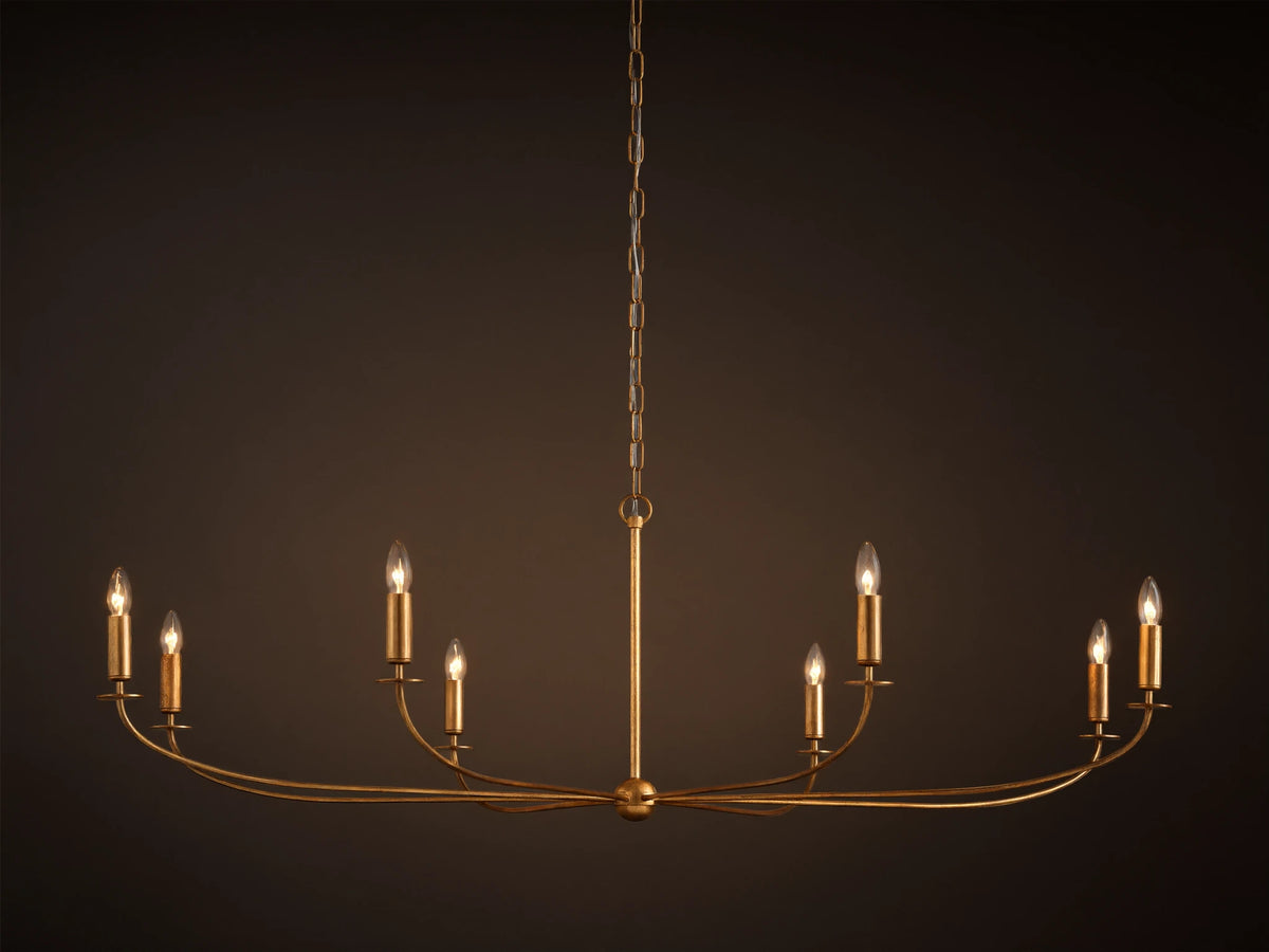 An Arnett Chandelier, an 8-light golden iron fixture with an antiqued leaf finish. Curved, elongated shape, suspended by chain.