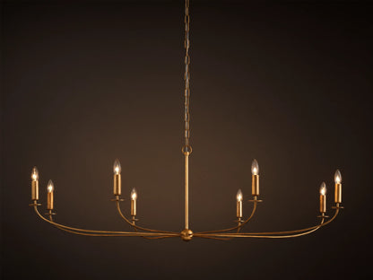 An Arnett Chandelier, an 8-light golden iron fixture with an antiqued leaf finish. Curved, elongated shape, suspended by chain.