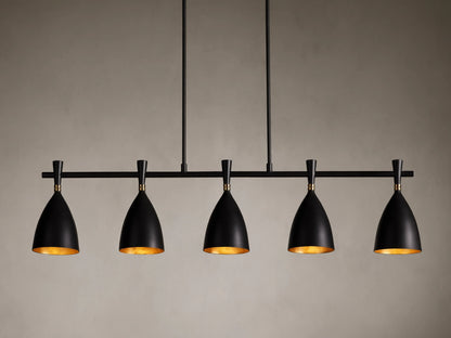 Jacarra Linear Chandelier with five black metal shades, gold leaf interior, hanging from an old bronze rod against a gray background.