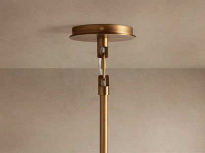 Adria 2-Light Chandelier, bronze-finished iron, illuminated cream conical shade with metal trim, seen close-up.