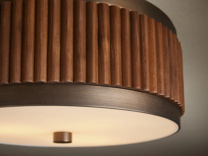 Ceiling-mounted light fixture with a round, ribbed wooden frame and a white frosted glass base, featuring a bronze accent.
