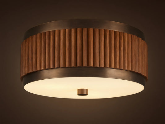 A circular ceiling lamp with a wooden, ribbed outer finish and a smooth, white frosted diffuser, emitting a warm light.