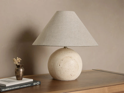 Front view of a Stone Sphere Table Lamp with a textured off-white spherical base and a tapered light grey fabric shade.