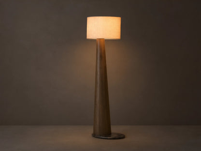 Front view of a tall floor lamp with a dark brown tapered wood base and a light beige rectangular fabric shade, emitting warm light.