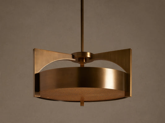 Burnished brass Alastair Pendant. Cylindrical shade, angular side supports, and a textured acrylic diffuser, hanging from above.