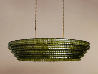 Oval Ghiaccio Chandelier with layered olive-green textured glass, glowing warmly, suspended by gold chains.