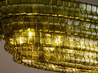 Ghiaccio Oval Chandelier, multi-layered textured green glass pieces forming an oval shape, suspended by two brass chains.