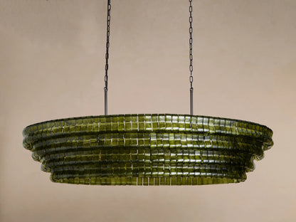 Ghiaccio Oval Chandelier: tiered, olive green curved glass blocks with warm internal glow, suspended by dark chains.