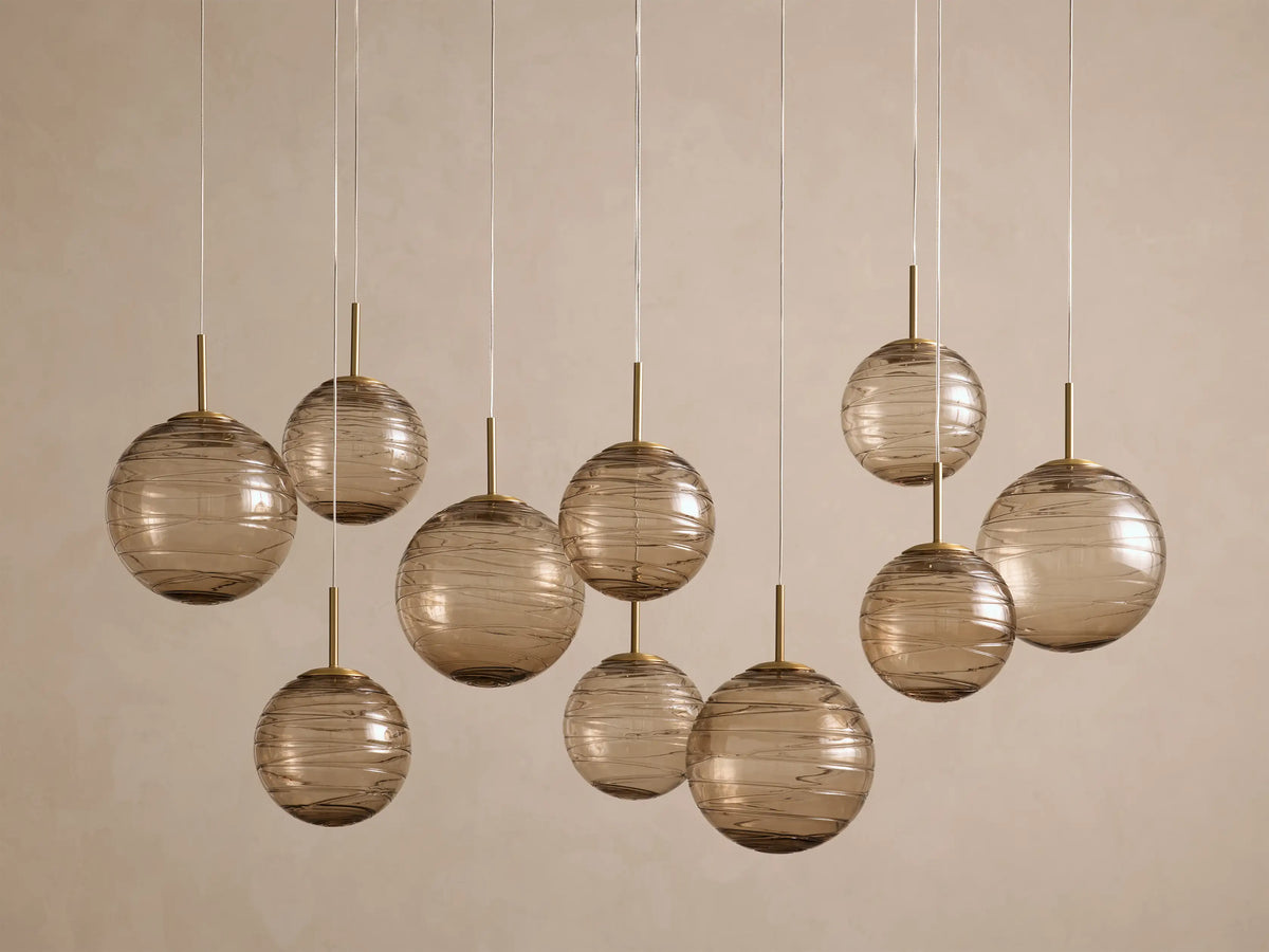 Casen 55" Linear Chandelier in Brass with Brown Sugar Globes (4 of 4)