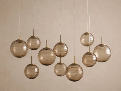 Casen 65" Linear Chandelier in Brass with Brown Sugar Globes (4 of 4)