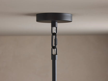 Saige Round Chandelier close-up: black ceiling canopy, black chain, and hanging rod against a light ceiling.