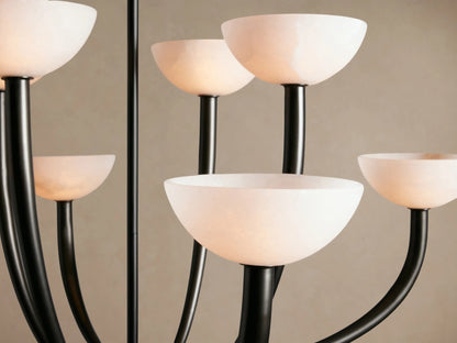 Saguaro Chandelier with 8 upward-curving dark metal arms and white, bowl-shaped alabaster shades.