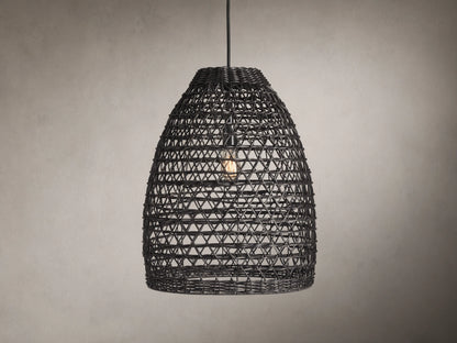 Braemar Outdoor Black Pendant with a woven all-weather wicker shade, hanging from a black fabric-wrapped cord, bulb visible within.