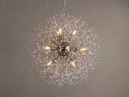 Dandelion Round Chandelier, nickel-plated with many thin arms radiating out, adorned with clear glass crystals and warm lit bulbs.