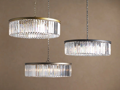 Close-up of Leyland Round Chandelier's dark oil-rubbed bronze canopy mounted to a light ceiling with a hanging iron chain.