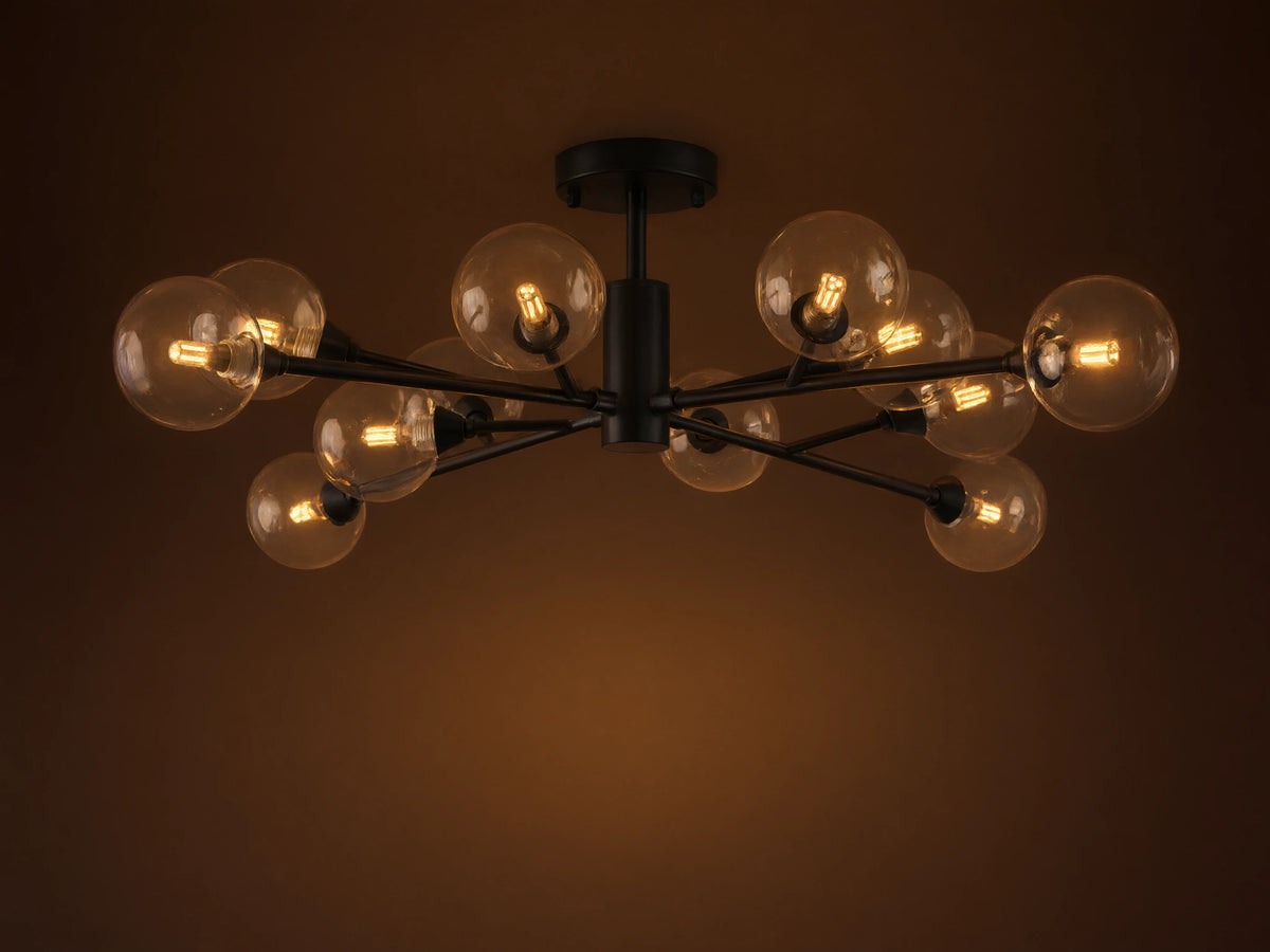 Apollo Flush Mount with an antiqued bronze finish, features multiple clear glass globes extending from a central fixture, mounted on a ceiling.