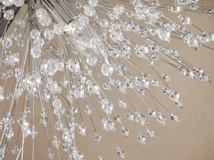 Sparkling Dandelion Flush Mount with clear crystal beads radiating from a polished chrome base against a light brown ceiling.