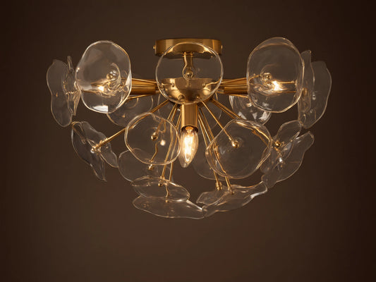 Gold Lily Flush Mount with multiple clear glass petals arranged around glowing bulbs, mounted on a neutral ceiling.
