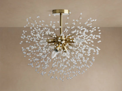 Gold Dandelion Flush Mount with sparkling clear crystal beads extending in a starburst, lights emitting warm glow on a neutral ceiling.