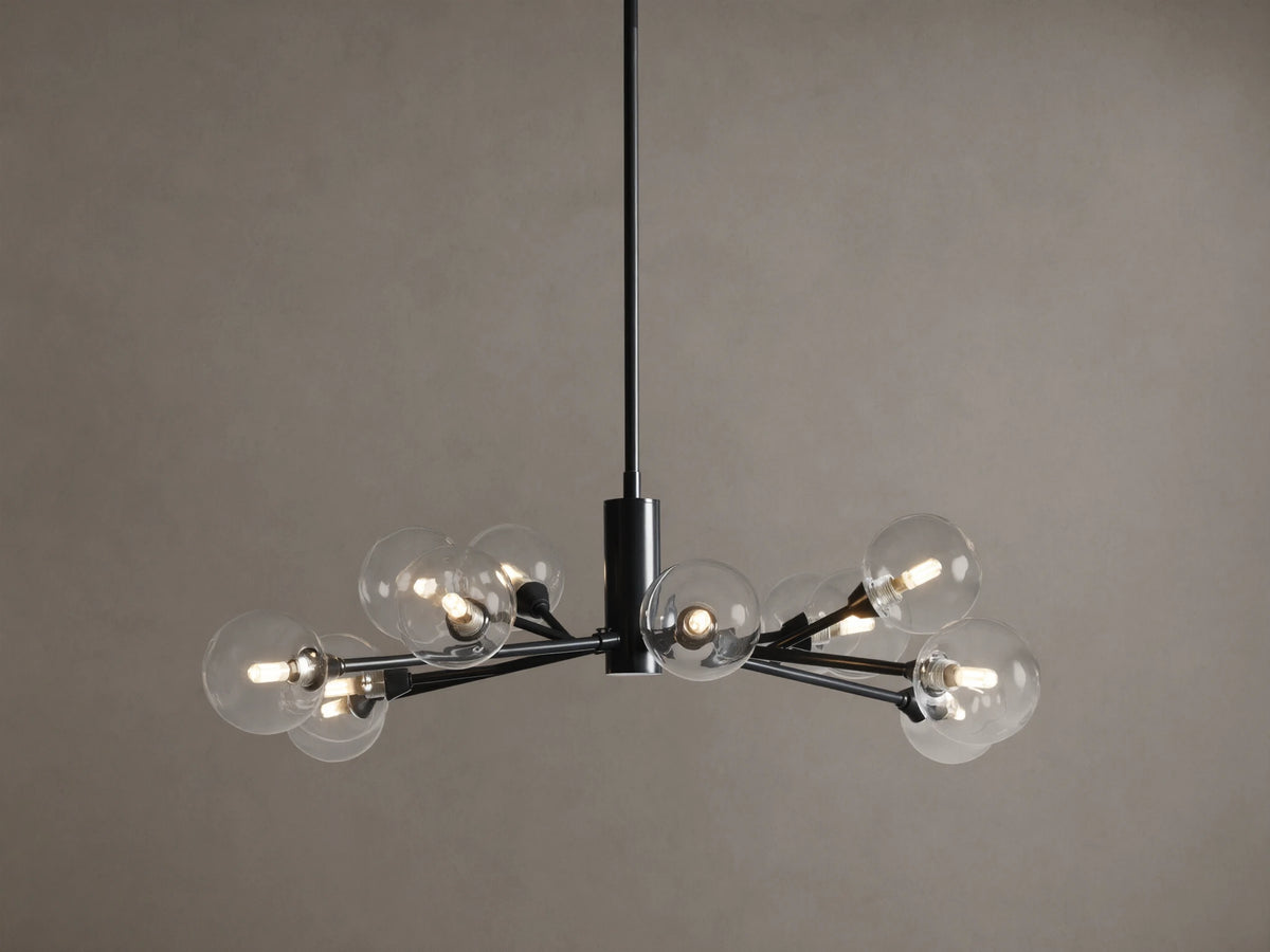 Apollo Round Chandelier: Black iron arms holding clear glass globes with illuminated bulbs, suspended on a tan background.