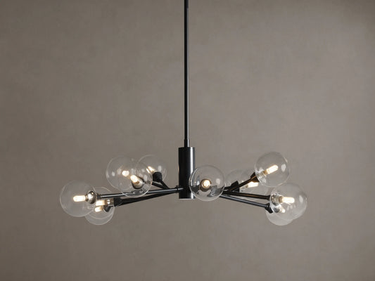 Apollo Round Chandelier: Black iron arms holding clear glass globes with illuminated bulbs, suspended on a tan background.