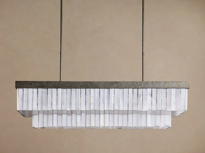 Cameron Rectangular Chandelier with antique silver frame, layers of glowing white selenite pieces, suspended from above.