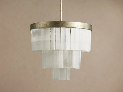 Cameron Round Chandelier: an antique silver ring tops tiered, translucent white selenite panels, emitting a warm glow.
