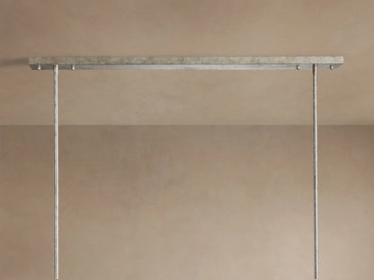 Close-up of Cameron Rectangular Chandelier, featuring an antique silver rectangular frame and hanging translucent white selenite strips.