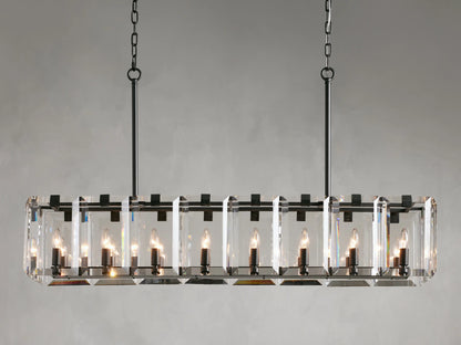 Rectangular chandelier with clear crystal panels and black iron frame, featuring twelve lit candle-style bulbs, hanging from chains.