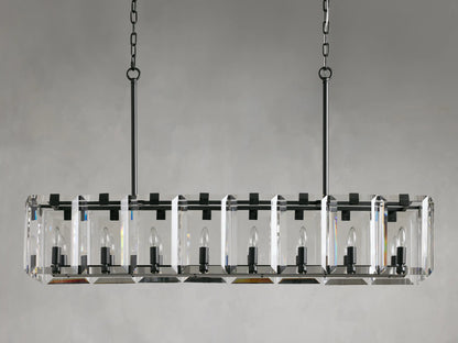 Rectangular chandelier with clear crystal prisms and black iron frame, suspended by two chains, featuring visible candle-style bulbs.