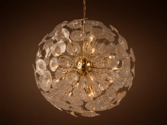 A large, round Lily Chandelier made of golden rods and many clear glass petals, with lights glowing inside.