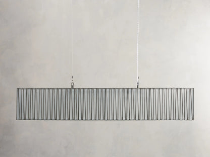 Jeunet Rectangular Chandelier in Nickel, horizontal. Its nickel frame has vertical rods, glowing warm light through a diffuser.