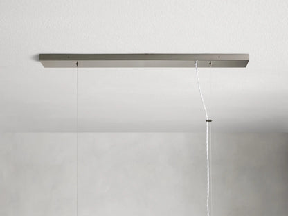 Jeunet Rectangular Chandelier in nickel, with vertical metal slats and frosted panels emitting a warm light.