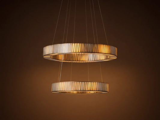 Jeunet 2-Tier Round Chandelier with two illuminated silver-toned circular tiers, featuring a vertical ribbed pattern.