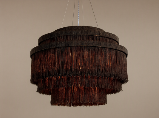 Romilly Tiered Chandelier, dark bronze iron with three tiers of hanging glass beads, warm light glowing from within.