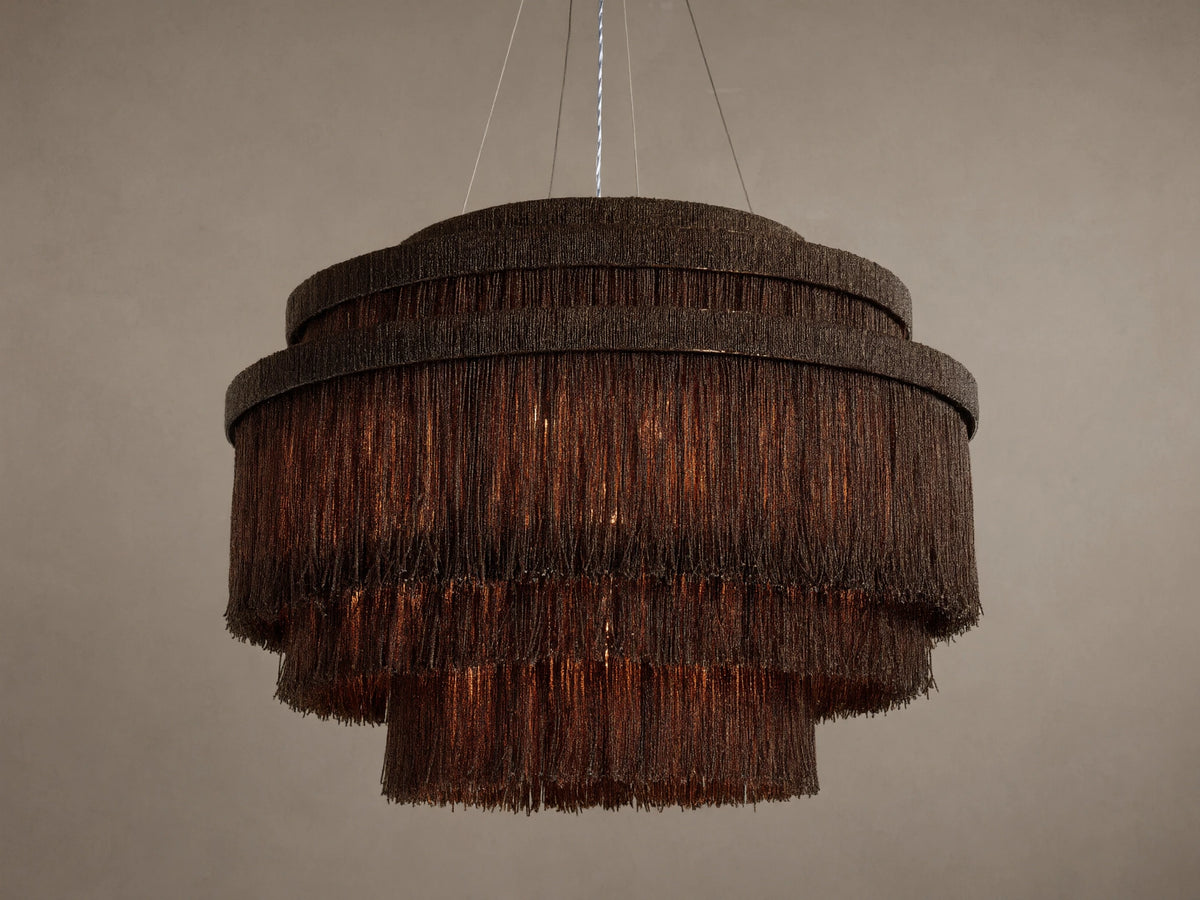 Romilly Tiered Chandelier, dark bronze iron with three tiers of hanging glass beads, warm light glowing from within.