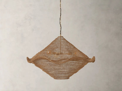 Mirza Sphere Chandelier: Woven antique brass mesh fixture with a soft, wavy square shape, three glowing bulbs visible inside, hanging.