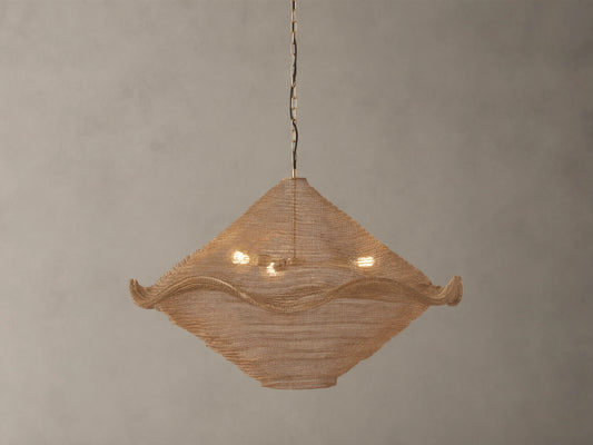 Mirza Sphere Chandelier. Draped woven antique brass mesh in a square shape with wavy edges, 3 glowing bulbs inside, hanging.