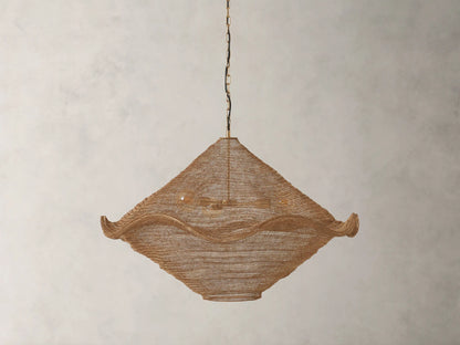 Mirza Sphere Chandelier. Draped woven antique brass mesh in a square shape with wavy edges, 3 glowing bulbs inside, hanging.