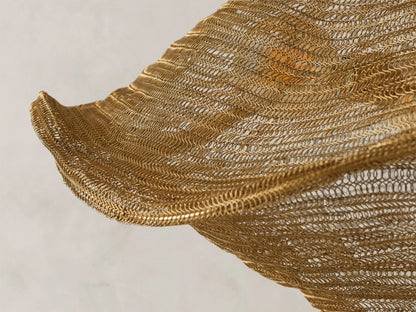 Mirza Sphere Chandelier: antique brass woven steel and brass fixture with a wavy, square-like shape, suspended from a chain.