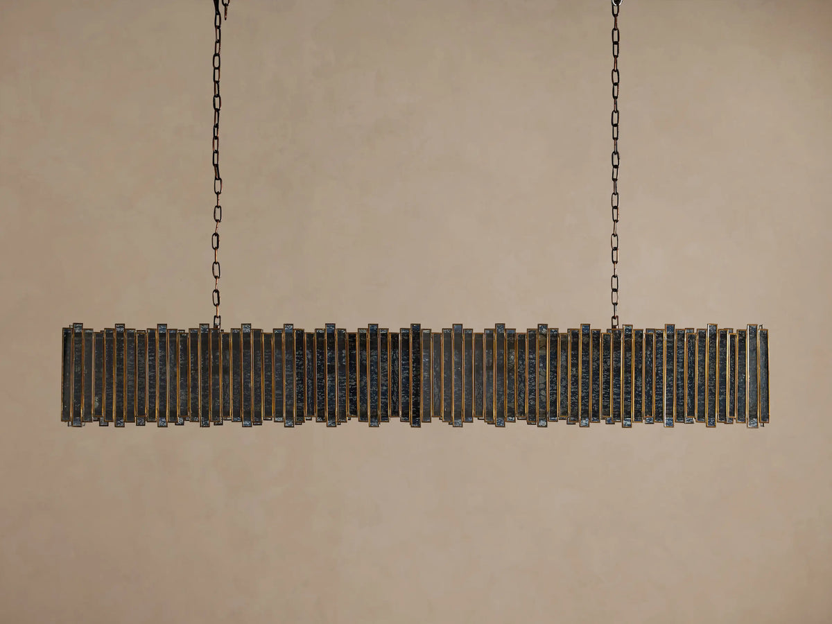 Laila Rectangular Chandelier, antique copper iron/brass frame with vertical antiqued mirrored-glass panes, glowing warm lights, hanging from chains.