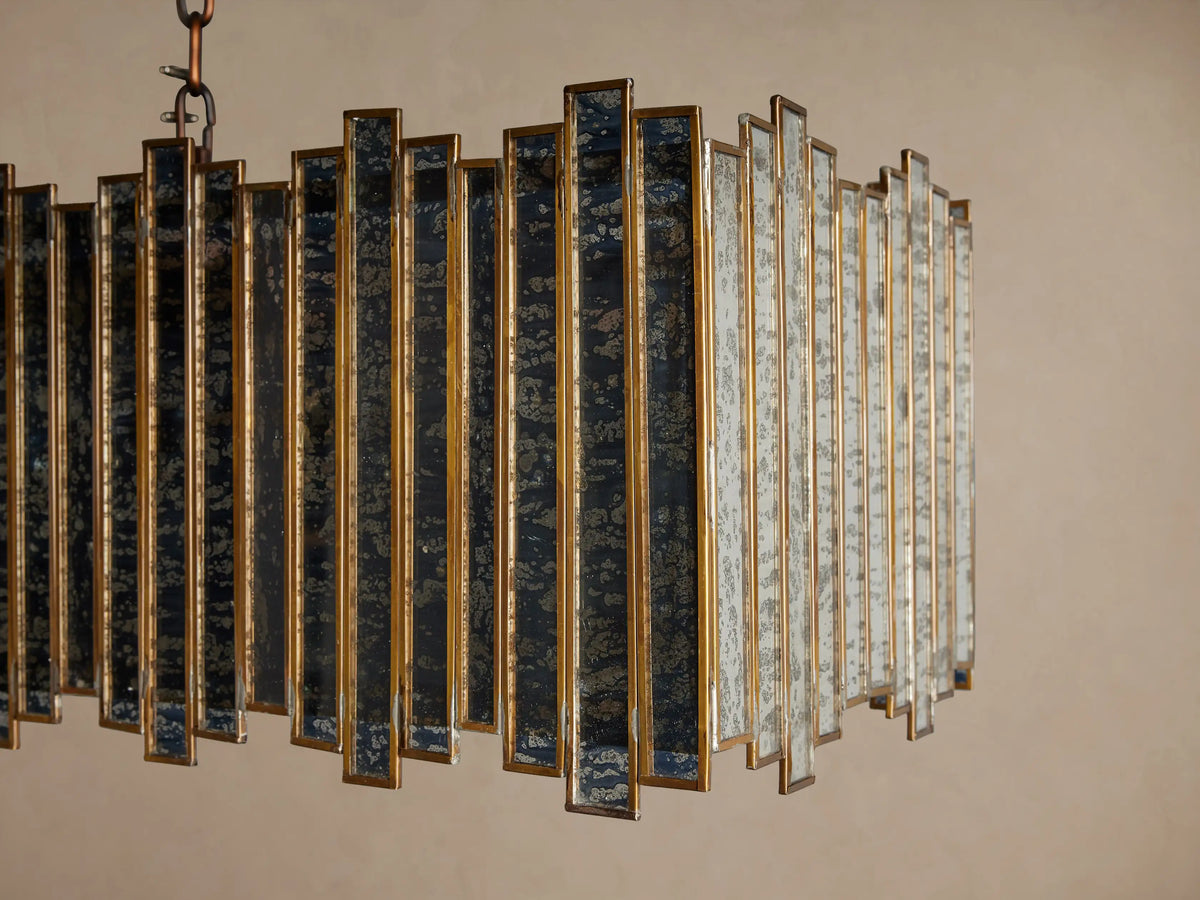 Laila Rectangular Chandelier, antique copper iron frame with vertical antiqued mirrored-glass panes, suspended by chains.