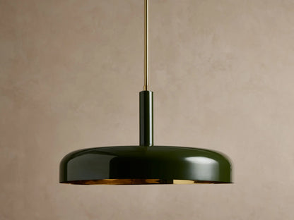 Bonham Pendant: Dark green, disc-shaped pendant light with a glossy finish & glowing brass interior, suspended by a brass rod.
