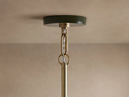 Shiny dark green Bonham Pendant light from below, showing its reflective brass interior with two warm, lit bulbs.