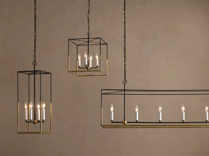 Holt Linear Chandelier's antiqued brass linear ceiling mount with two brass chains descending, one with a black cord.