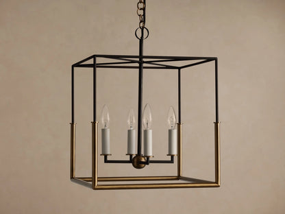 Holt Square Pendant, a square, open-cage light fixture with black and antiqued brass frames, featuring four clear candle-style bulbs.