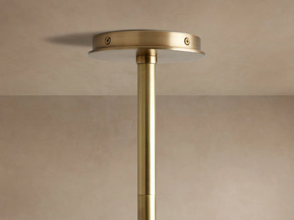 Close-up of Randall Leather Pendant's dark, ribbed leather-wrapped bar with burnished brass connection to an angled rod.