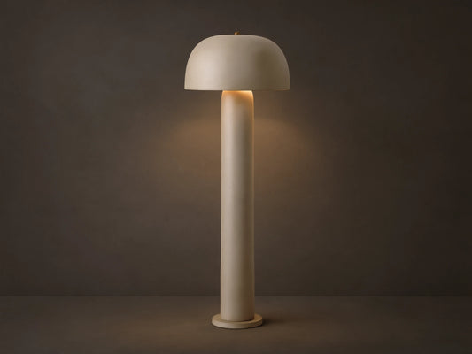 Front view of the beige Mushroom Floor Lamp with cylindrical body and dome shade, emitting warm light.